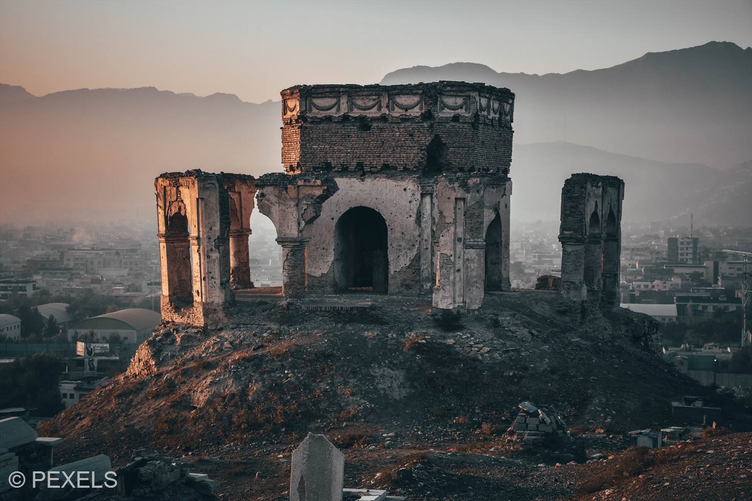 Grey concrete building on the top of a hill in Kabul, Afghanistan.